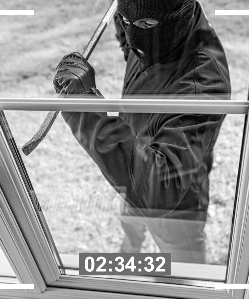 Cctv,View,Of,Burglar,Breaking,In,To,Home,Through,Window Cctv,View,Of,Burglar,Breaking,In,To,Home,Through,Window